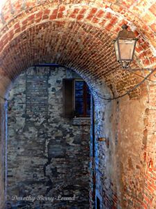 looking through a brick archway