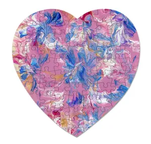 A heart-shaped jigsaw puzzle featuring a pink abstract design.