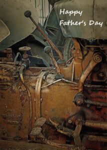 Detail of an antique tractor with the words Happy Fathers Day