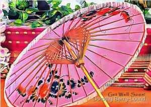 A greeting card featuring a pink parasol on an orange background and the words Get Well Soon